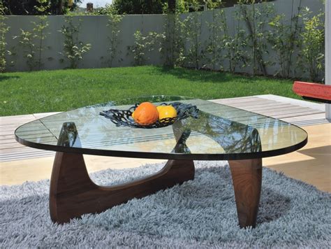 Sculptor isamu noguchi took wood and glass and blended them together to make this graceful, organically shaped coffee table. Classic Noguchi Coffee Table