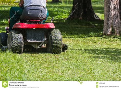 The Gardener Is Using A Lawn Mower Stock Photo Image Of Nature Mower