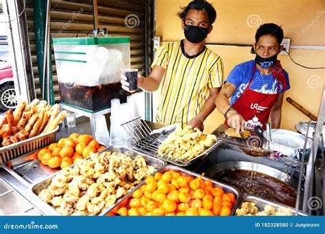 Street Food Vendors Sell Assorted Deep Fried Food In Their Food Cart