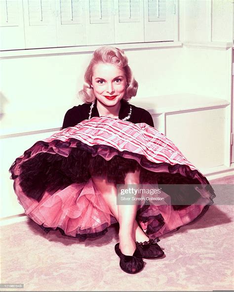 Janet Leigh Us Actress Sitting Against A White Wall Wearing A