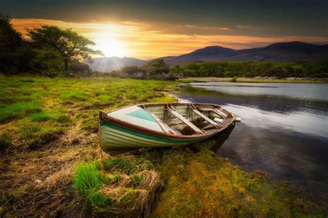 Beautiful Scenery Of The Killarney Lake With Boat At Sunset In County