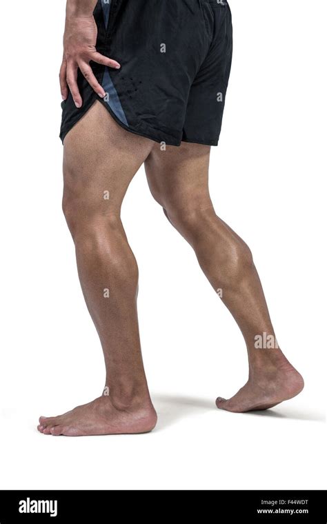 Muscular Man Flexing Leg For Camera Stock Photo Alamy