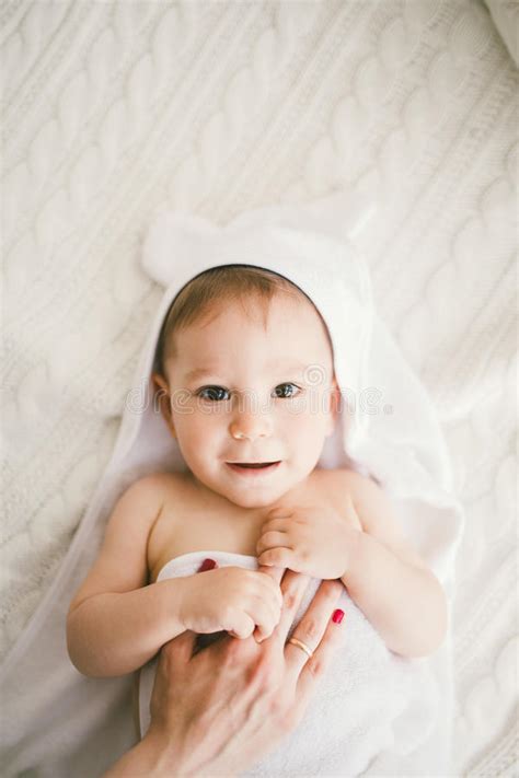 Beautiful Smiling Newborn Baby Boy Covered With White Bamboo Towel With
