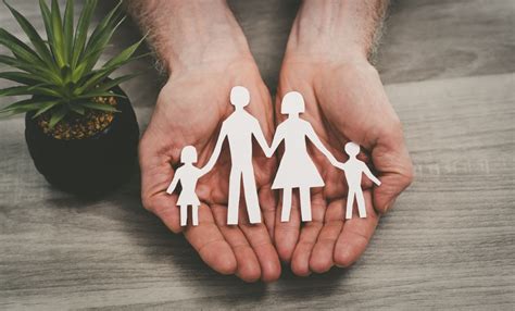 outstretched hands protecting family | Dickey Mccay Insurance