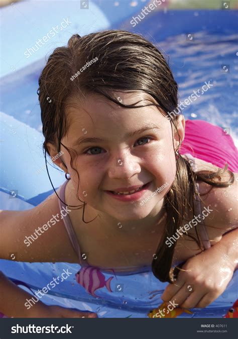 Adorable Little Girl Swimming In A Backyard Pool Stock Photo 407611