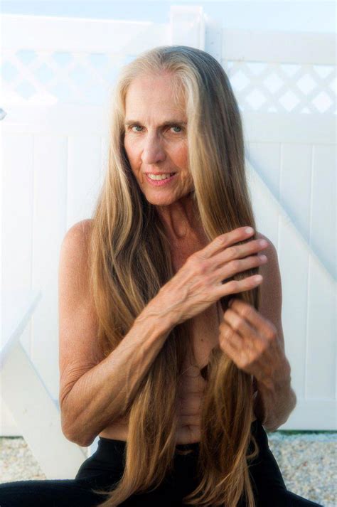 Partially Nude 57 Year Old Woman With Long Hair Smiling At The Camera Superstock