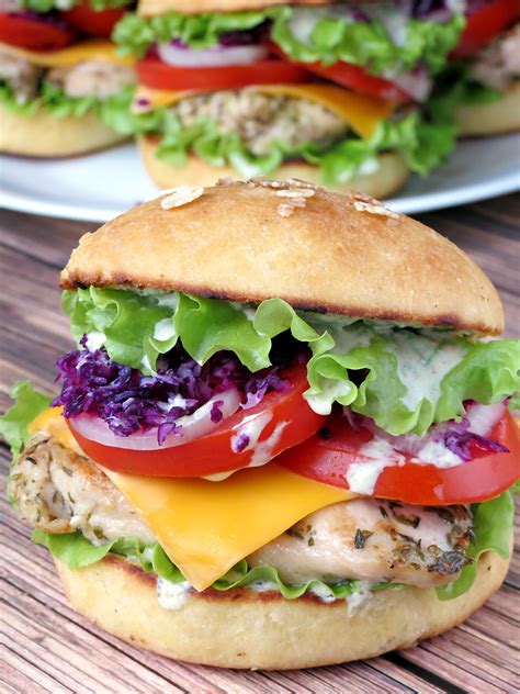 Chicken burgers from delish.com have a slight kick from smoked paprika and green onions, and pair beautifully with your choice of toppings. Chicken Burgers With Yogurt Pesto Sauce - Yummy Addiction