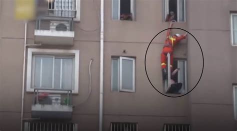 Video Firefighter Saves Suicidal Woman By Kicking Her Inside