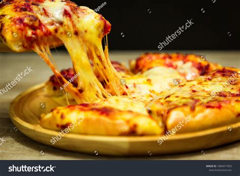 Hot Pizza Slice Dripping Mozzarella Cheese Foto Stock 1069471835 Shutterstock