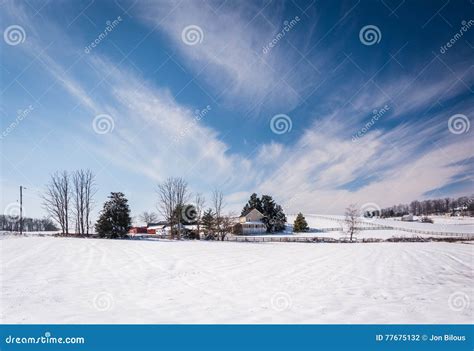 Wispy Clouds Over A Snow Covered Farm In Rural Carroll County M Stock