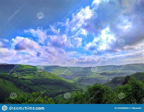 A Stunning View Into A Vast And Lush Green Valley Stock Photo Image