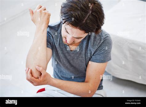 Man With Painful Elbow Stock Photo Alamy