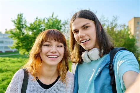 Young Teenage Friends Guy And Girl Having Fun Laughing Taking Selfie Photo Stock Image Image