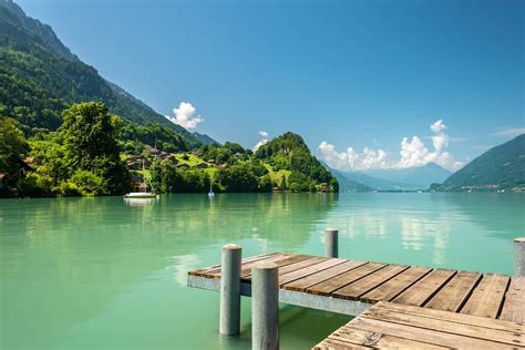 View Of Brienz Lake With Clear Turquoise Water Wooden Pier