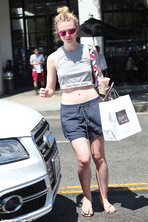 Elle Fanning Flashes Her Toned Tummy In Crop Top For Lunch Outing