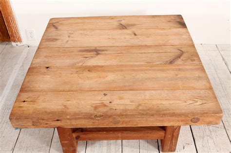 The mode square coffee table is handcrafted in solid wood and inspired by 1950's brutalist architecture. Rustic Wood Block Square Coffee Table at 1stdibs