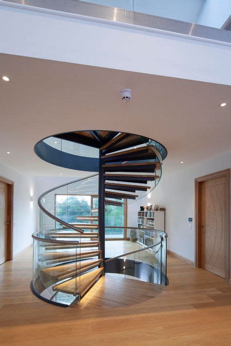 This Beautiful Spiral Staircase Has Timber Treads And Glass Balustrade