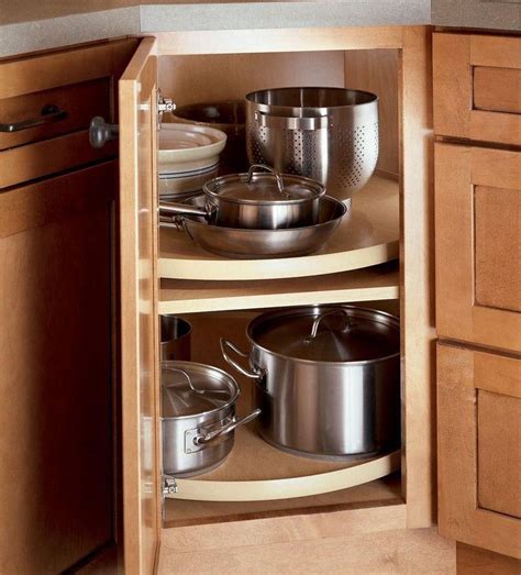 Traditional modular cabinets create a blind corner cabinet between the kitchen base and wall cabinets. Corner lazy Susan for pots and pans #kitchencabinets ...