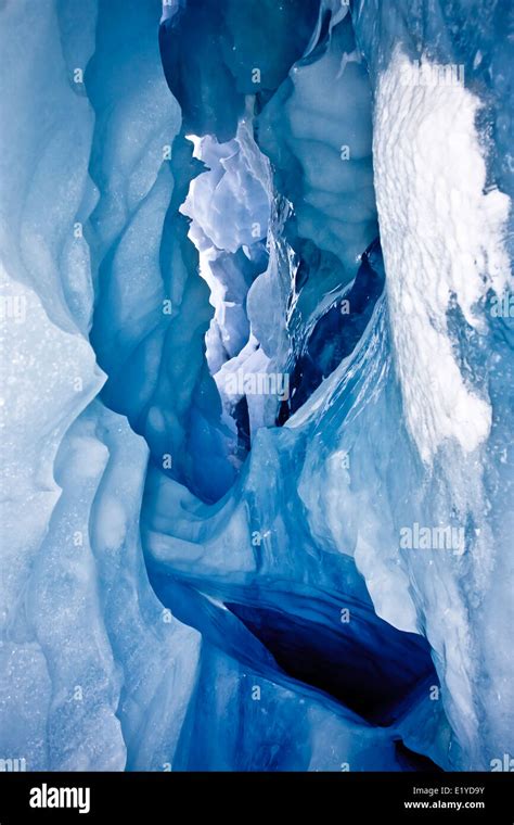 Blue Ice Cave Covered With Snow And Flooded With Light Stock Photo Alamy