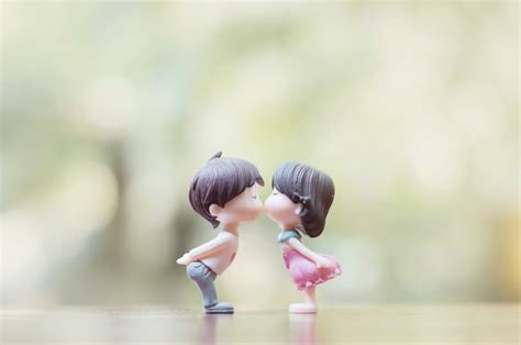Premium Photo Close Up Of Mini Couple Dolls In Romantic Kiss