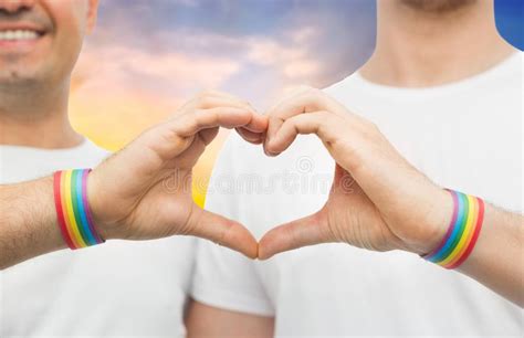 Gay Couple With Rainbow Wristbands And Hand Heart Stock Image Image