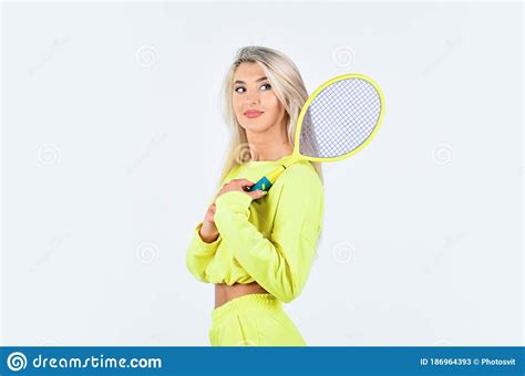 challenging herself woman playing tennis at court focus on racket hitting ball professional