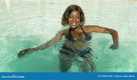 Happy And Beautiful Black African American Woman In Bikini Having Fun At Tropical Beach Resort