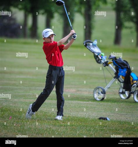 Junior child teenager golfer playing golf Stock Photo - Alamy