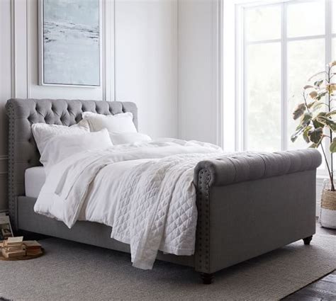 This platform bed is detailed with button tufts and padding for extra comfort. Chesterfield Tufted Upholstered Bed with Footboard ...