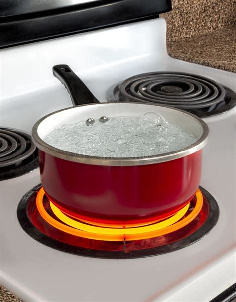 Red Pan With Boiling Water On Top Of Stove Stock Image Image Of