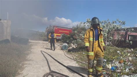 Jamaican Fireman Put Out A Blazing Fire On The Beach In Portmore St