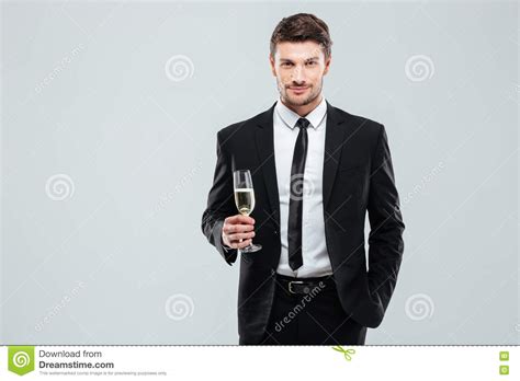 Confident Man In Suit And Tie Holding Glass Of Champagne Stock Image