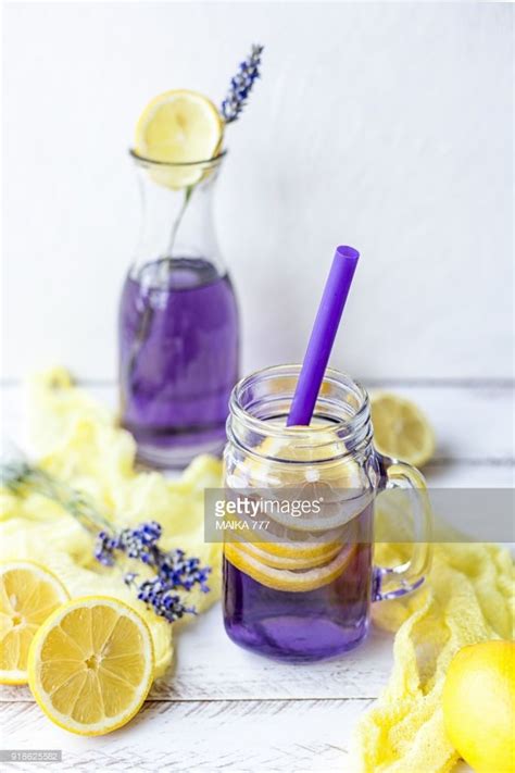 Photo Homemade Lavender Lemonade With Lemon In A Jar Glass With