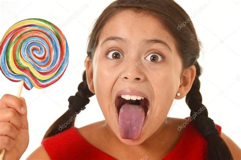 Sweet Beautiful Latin Female Child Holding Big Lollipop Candy Eating