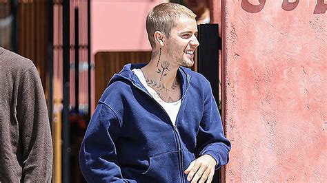 justin bieber shows off his tattoos in sexy tank top and baggy jeans while out in la photos