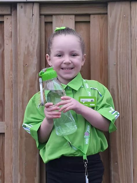 little bella rose loves her day working at asda as part of her school s aspirations day