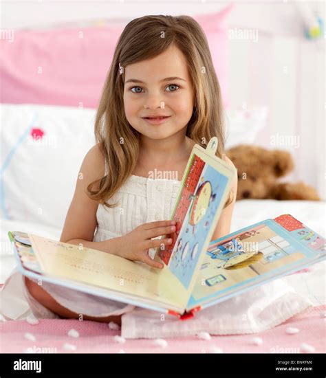 Beautiful Little Girl Reading In Bed Stock Photo Alamy