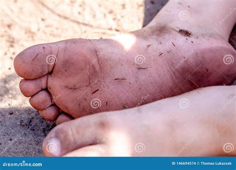 Holiday Concept Of Dirty Child Feet On Dirty Soil Stock Photo Image