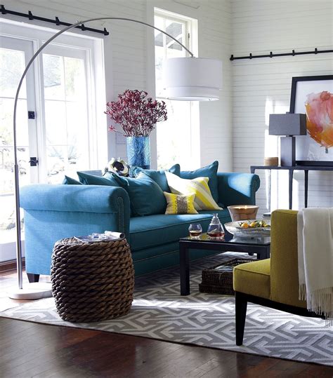 Library interior design involves designing for different age groups, people who are there for study or research purposes and individuals who just wish to calm down with associates and read. Image result for rooms with teal sofa | Yellow living room, Living room colors, Teal living rooms