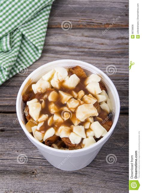 Original quebec poutine is made with white cheddar cheese curds. Poutine Quebec Meal Closeup Stock Photo - Image of cheese ...