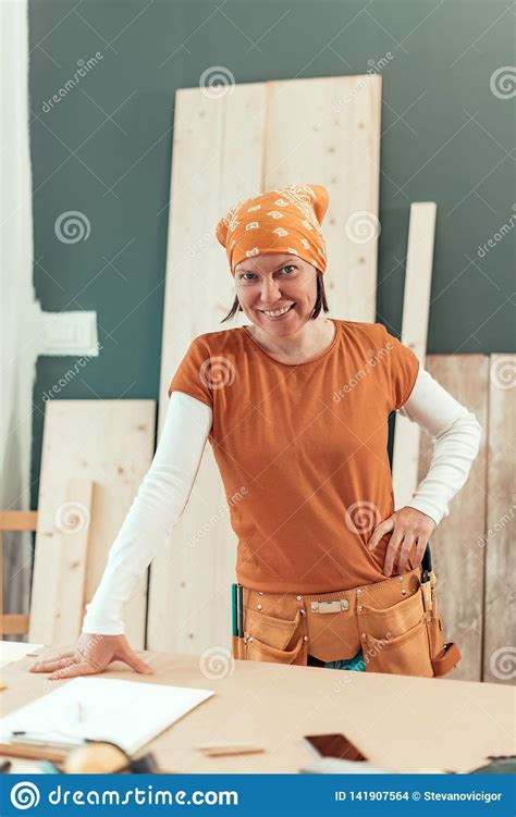 This guide, which includes an. Self Employed Female Carpenter Smiling Portrait Stock ...