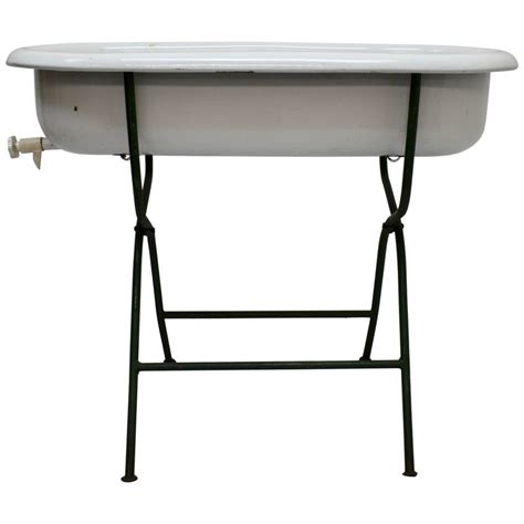 The stokke® flexi bath® stand is designed to bring you and your baby closer for bath time bonding and fun. Vintage Porcelain Enamel Baby Bath on Folding Wrought Iron ...