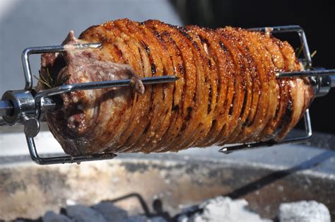 fire and food spit roasted pork belly