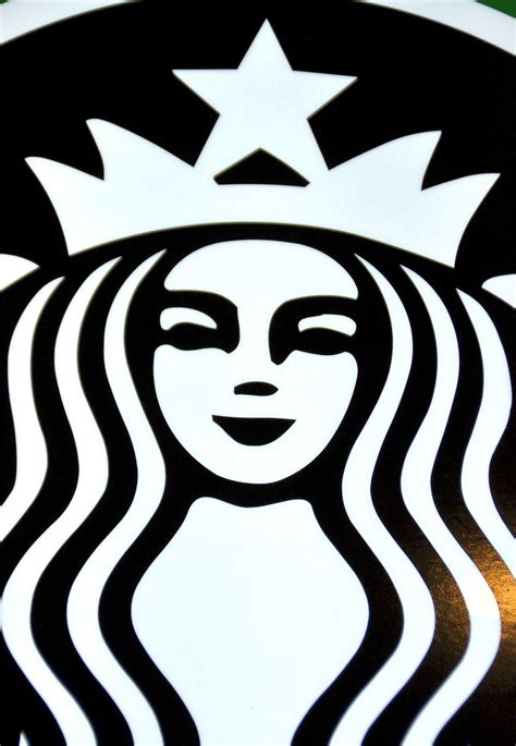 (which is a smart move, as your logo is the face of starbucks' current logo is minimalist compared to previous designs. Siren in Starbucks Coffee Logo from Faces on the Strip at Las Vegas, Nevada - Encircle Photos