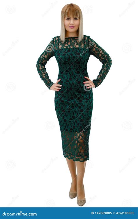 A Woman In A Green Dress Stands On A White Background Stock Image