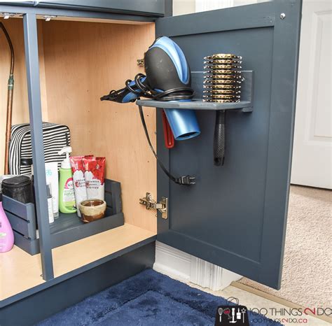Take pvc y connecter and paint. In-cupboard hair dryer holder | 100 Things 2 Do