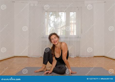 Smiling Woman Exercising Yoga On Mat At Home Stock Image Image Of