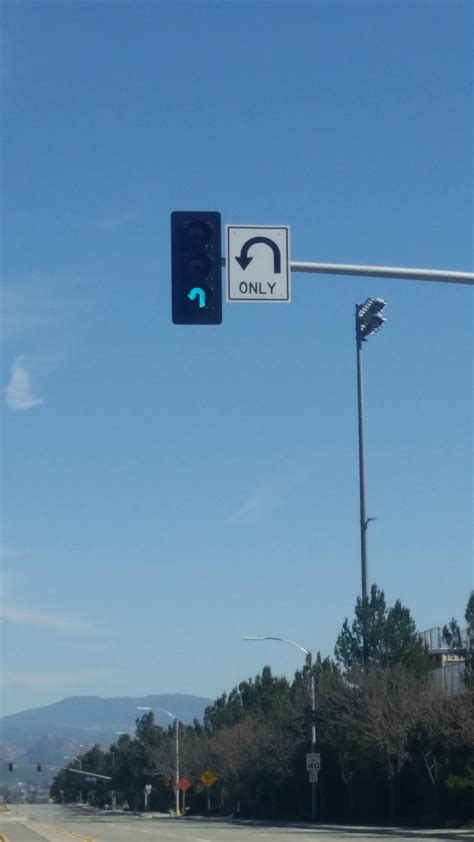 The light on this signal is shaped like a u-turn : mildlyinteresting