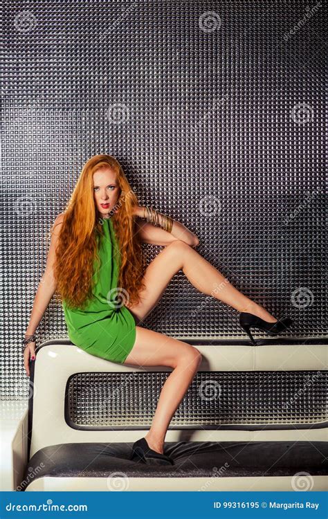A Young Redhead Girl In Fashionable Clothes For Night Club Stock Image