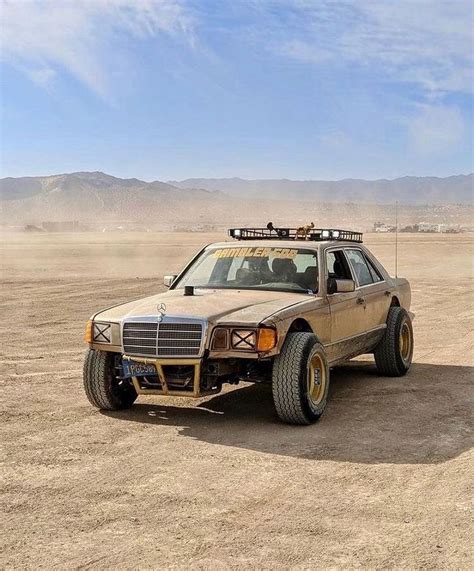 An Off Road Vehicle Is Parked In The Desert